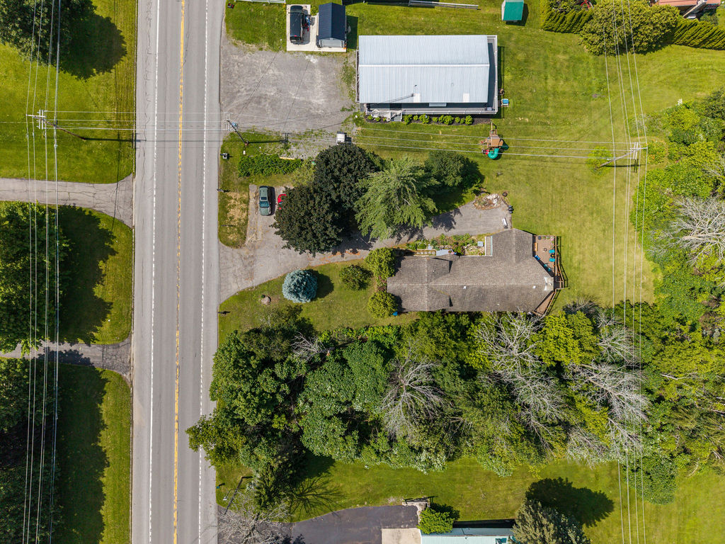 Top-down aerial showing the property, driveway and State Highway 37 frontage