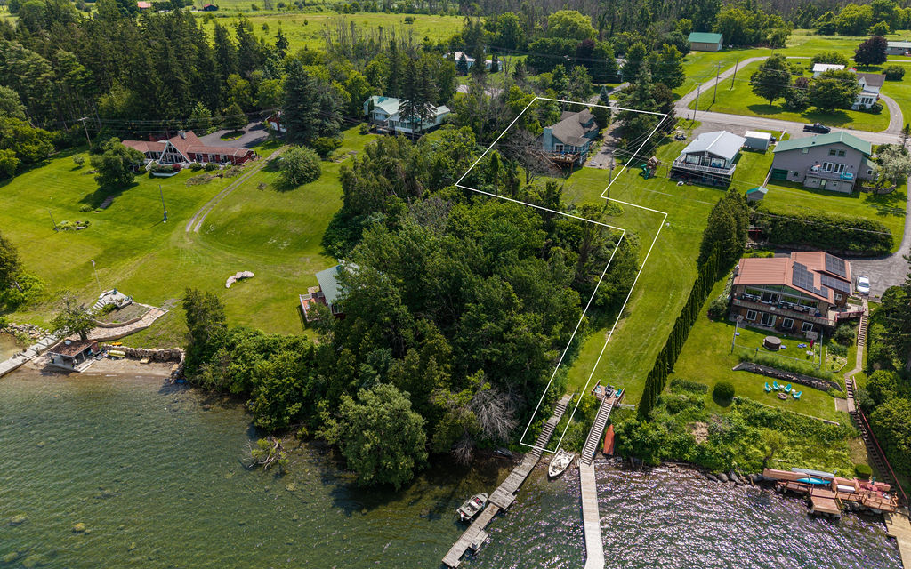 Aerial photo with property boundary lines marked from road to waterfront
